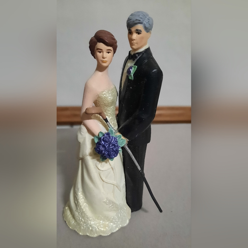 Humorous golfer wedding cake topper